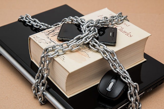 laptop, book & phone securely chained together